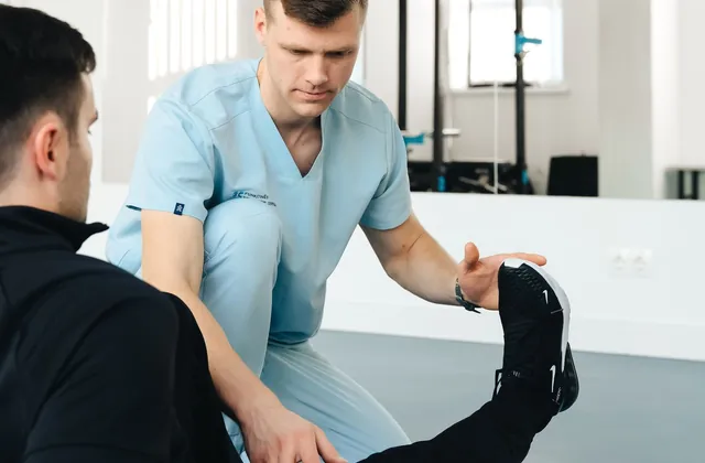 Person holding their lower back in discomfort